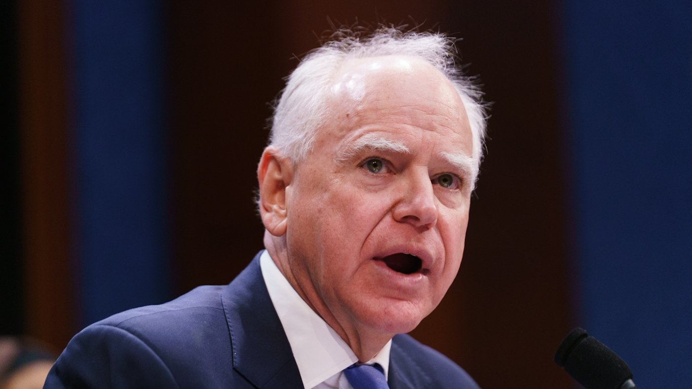 Walz Accuses Trump of 'Fascist-Curious' Actions, Warns of Democratic Backslide at Global Summit